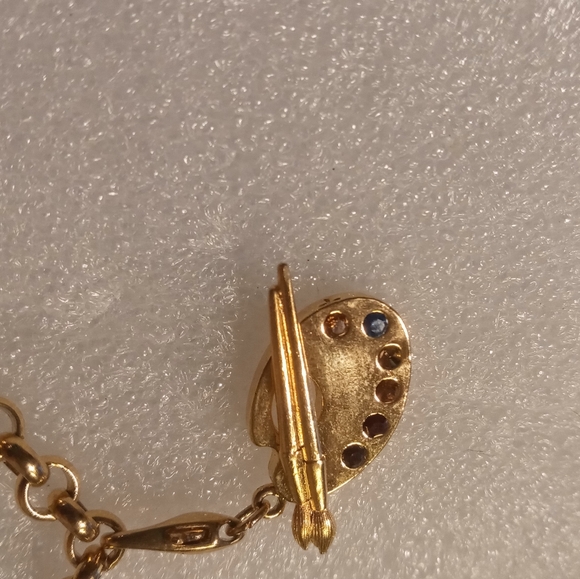 Faberge egg charm bracelet on a gold tone rolo chain. - Picture 12 of 16